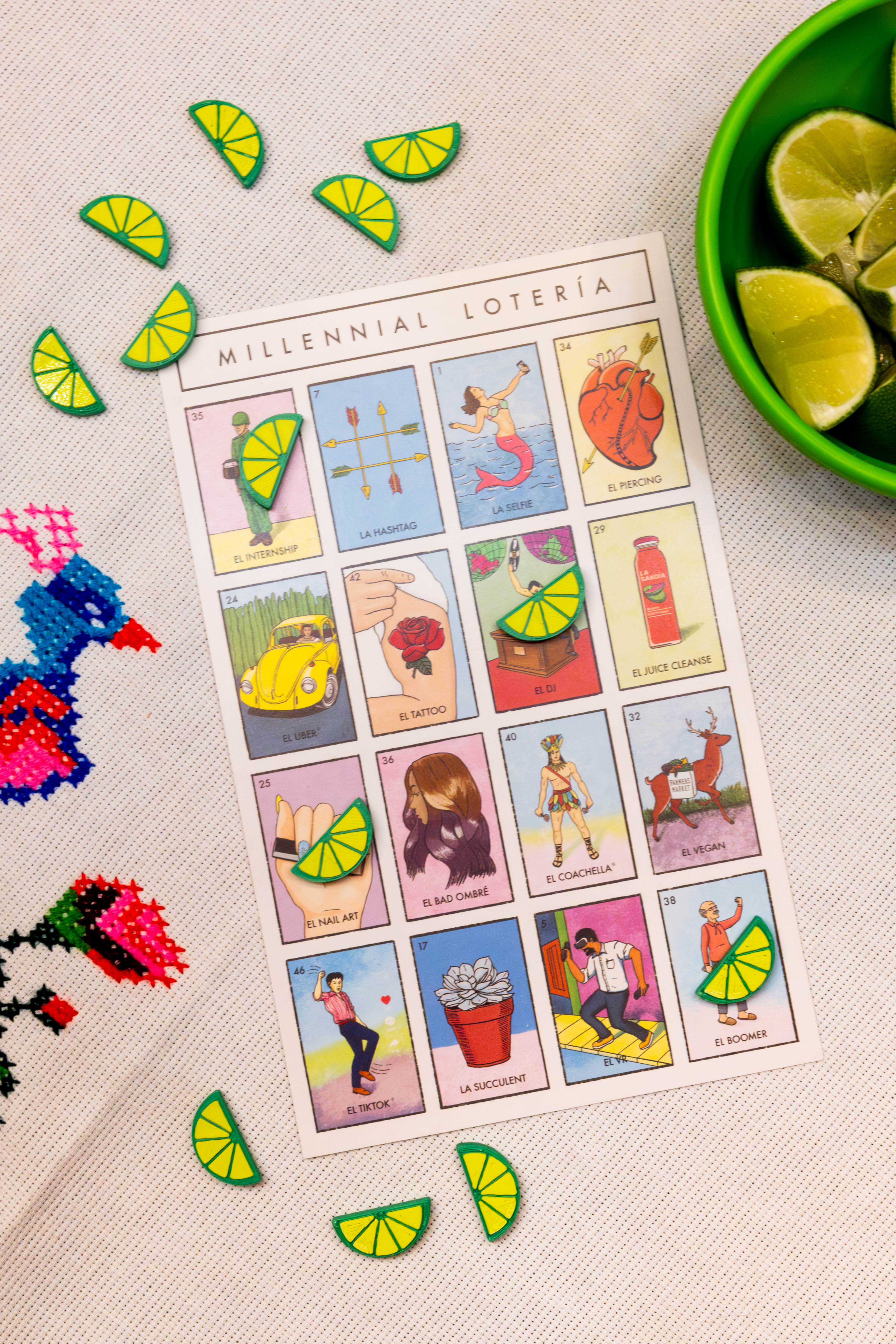 Casa Capitas fichas arranged around a lotería board